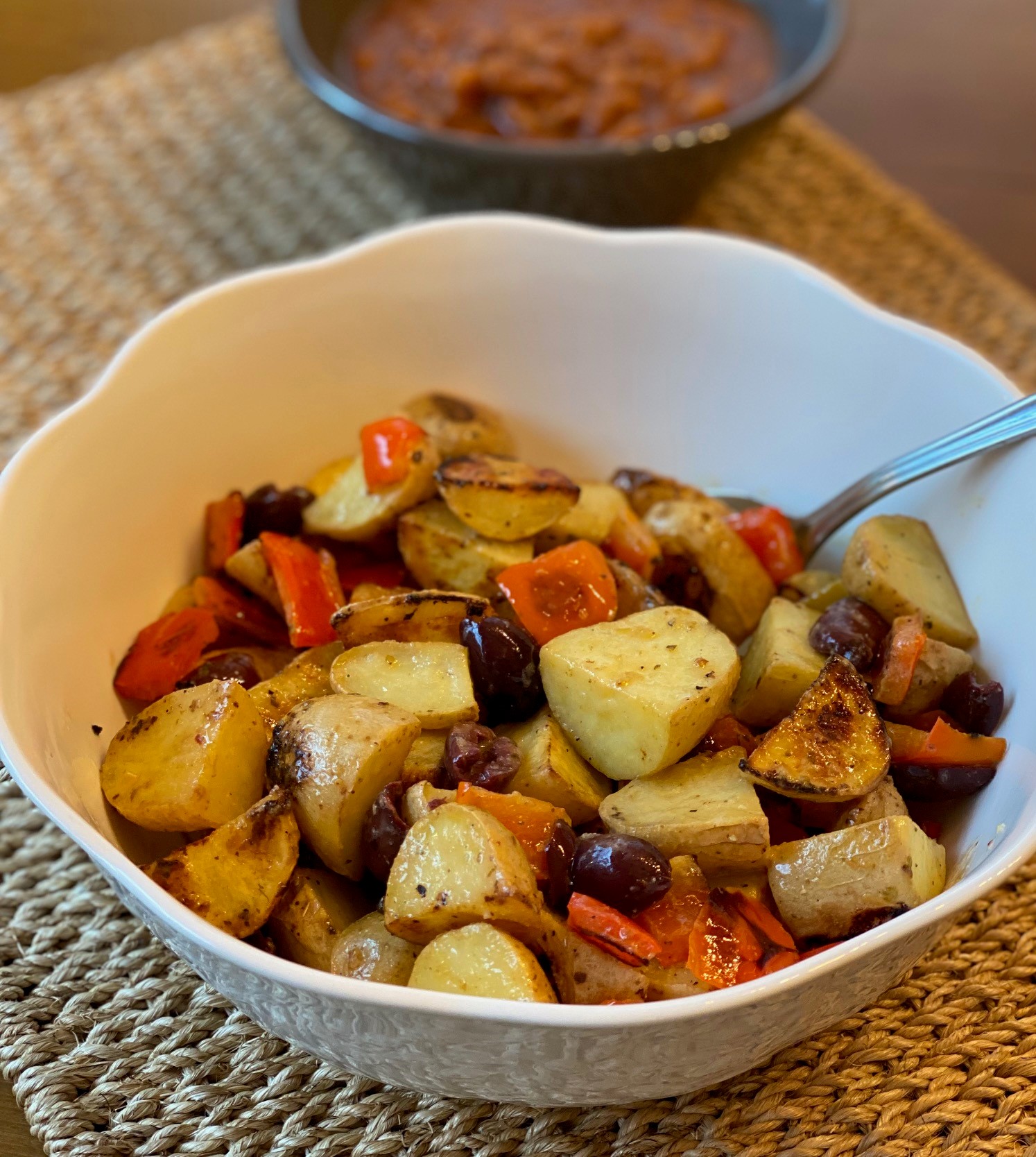 A bowl of roasted potato salad