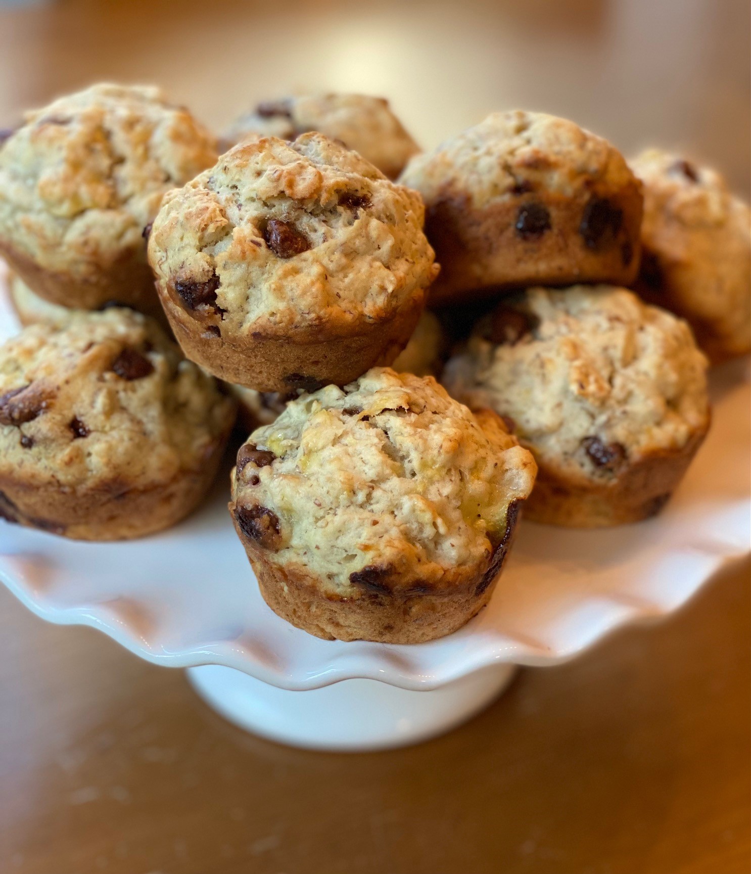 a plate of vegan banana chocolate chip muffins