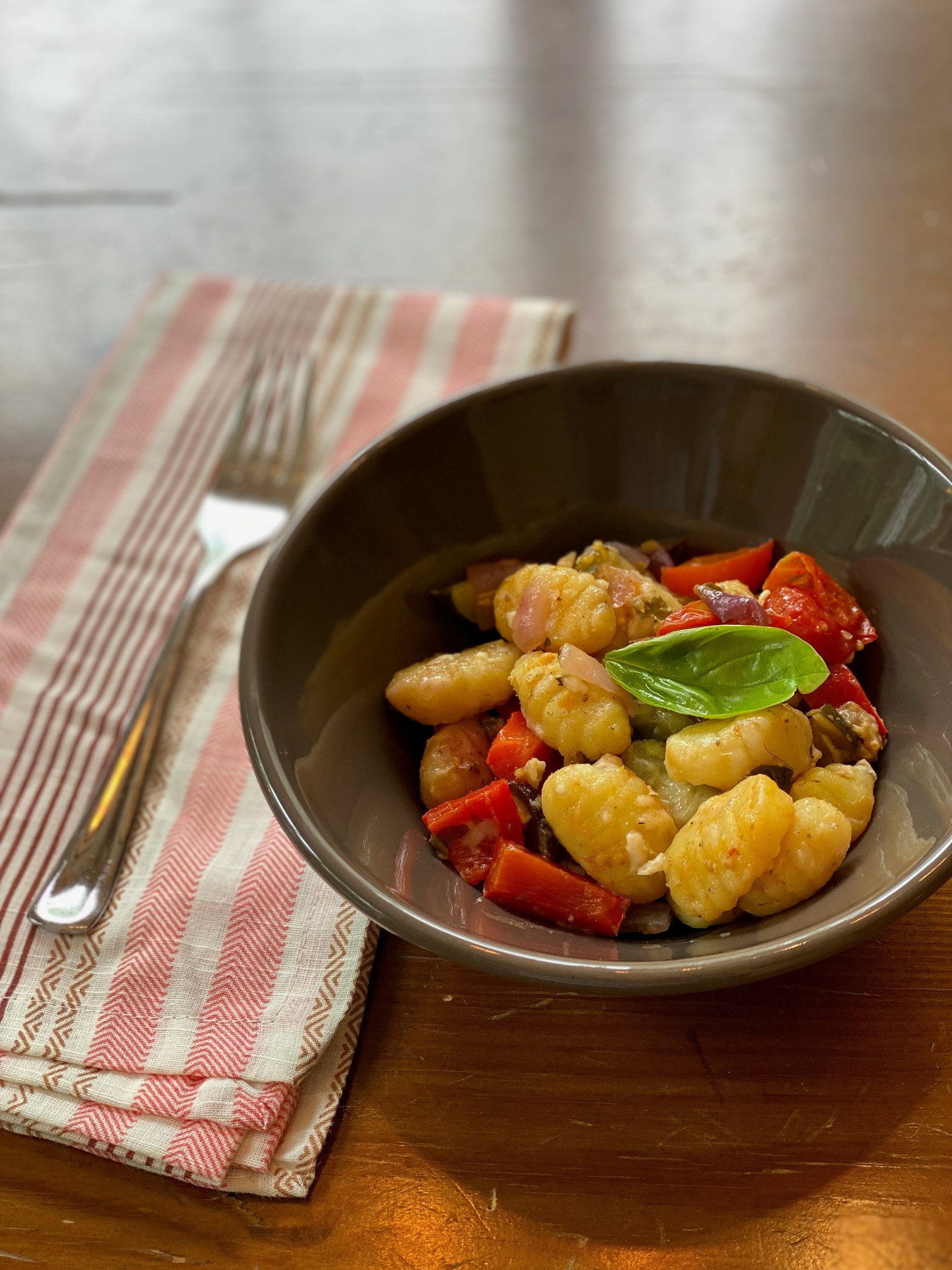 Bowl of gnocchi with roasted vegetables