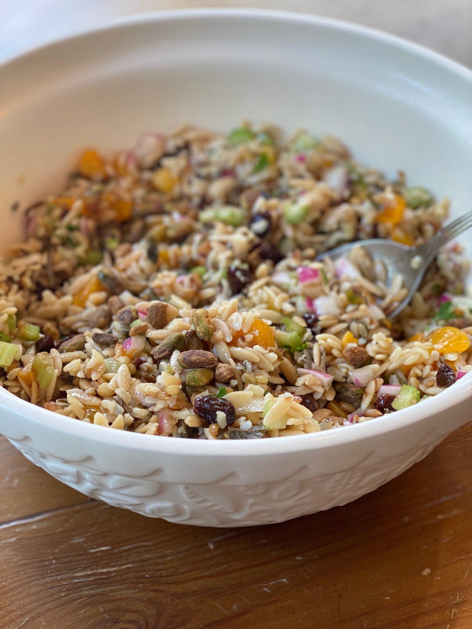 Bowl of orzo and fruit salad