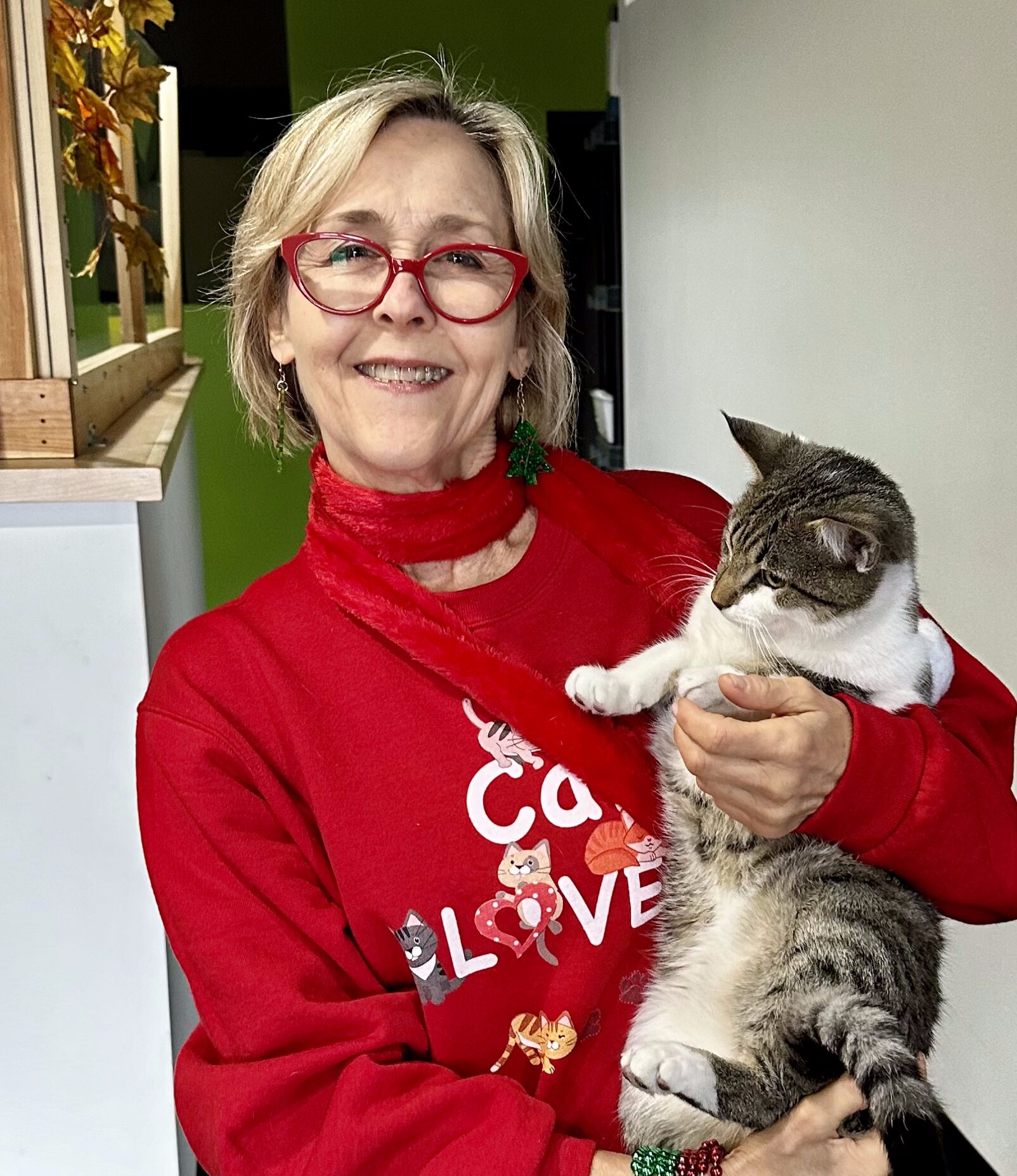 Beautiful woman holding a cat.